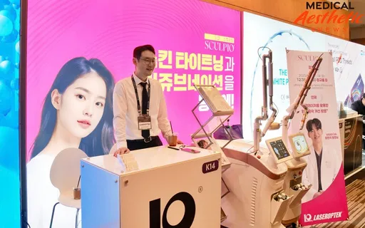 An exhibitor demonstrating a laser device